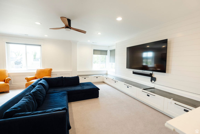 924 Country Lane Farmington, UT 84025 - Photo 50 of 91 Recreation space featuring a wall-mounted television, an extensive built-in media console with cabinet storage, and shiplap accent wall