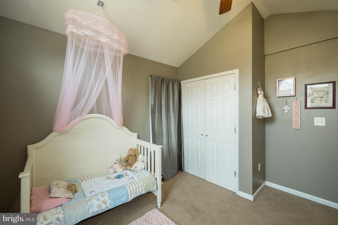 8339 Kines Road Warrenton, VA 20187 - Photo 11 of 19 a bedroom with a bed and wooden floor