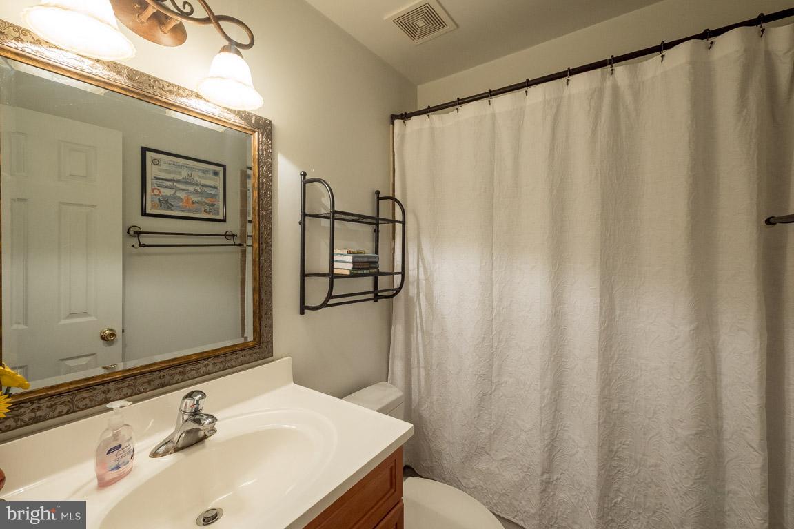 8339 Kines Road Warrenton, VA 20187 - Photo 15 of 19 a bathroom with a sink and a mirror