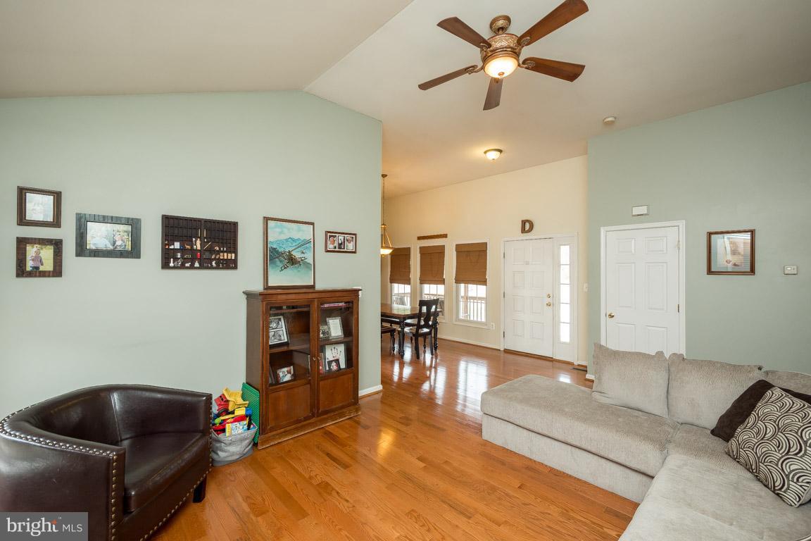 8339 Kines Road Warrenton, VA 20187 - Photo 3 of 19 a living room with furniture and wooden floor