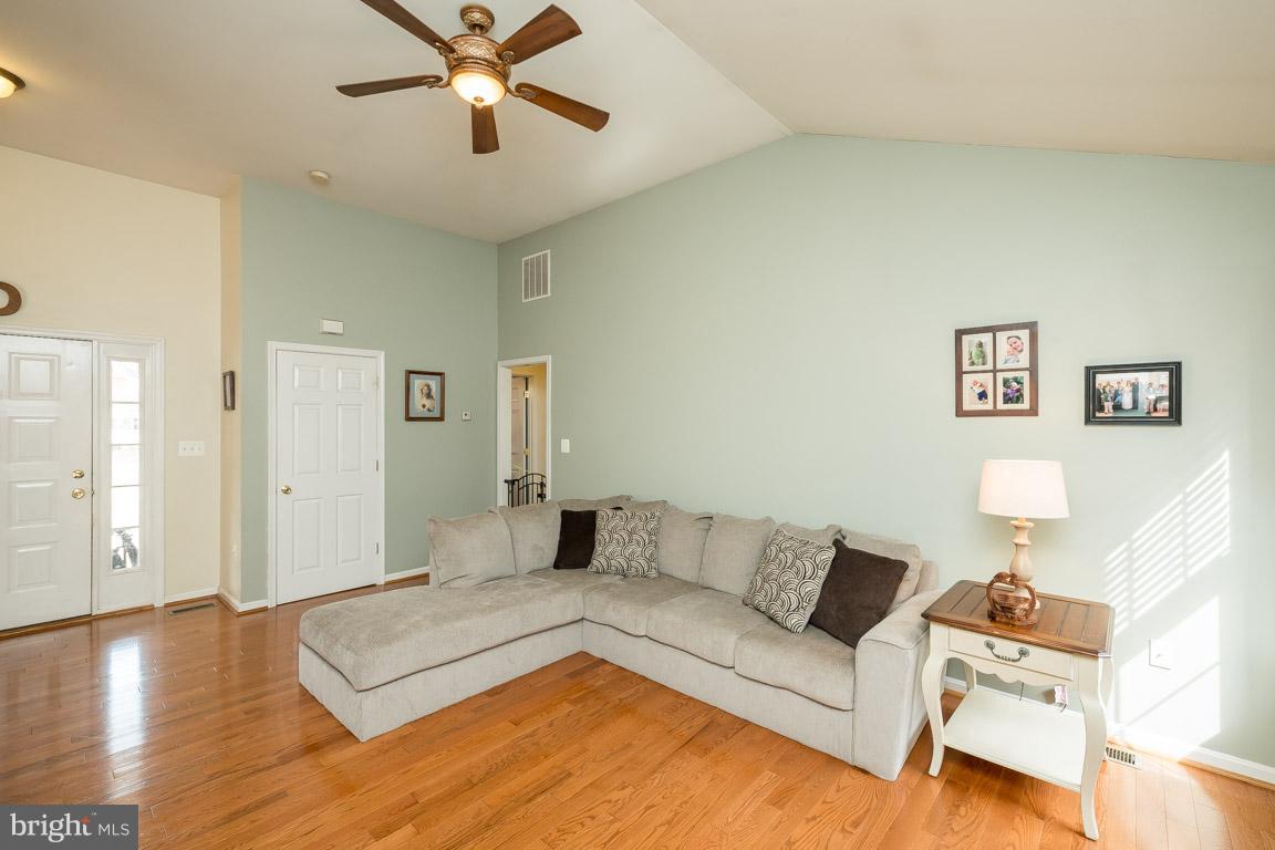 8339 Kines Road Warrenton, VA 20187 - Photo 4 of 19 a living room with furniture and a wooden floor
