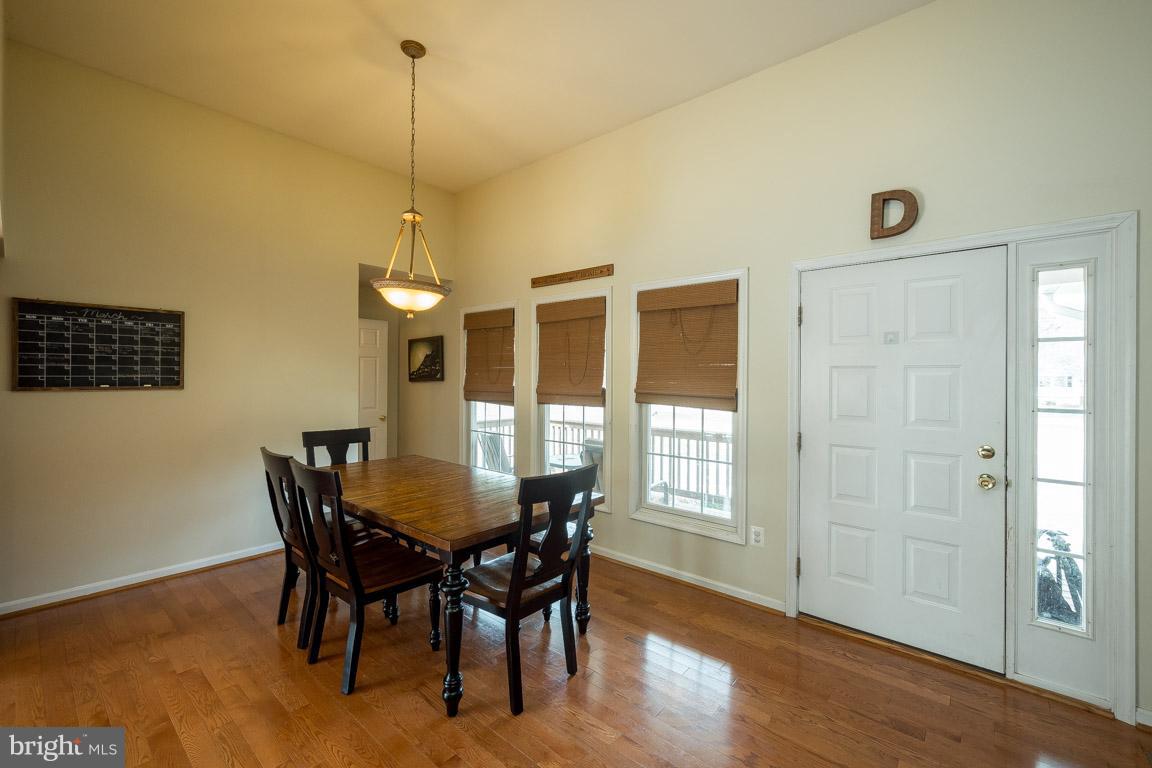 8339 Kines Road Warrenton, VA 20187 - Photo 5 of 19 a view of a dining room with furniture window and wooden floor