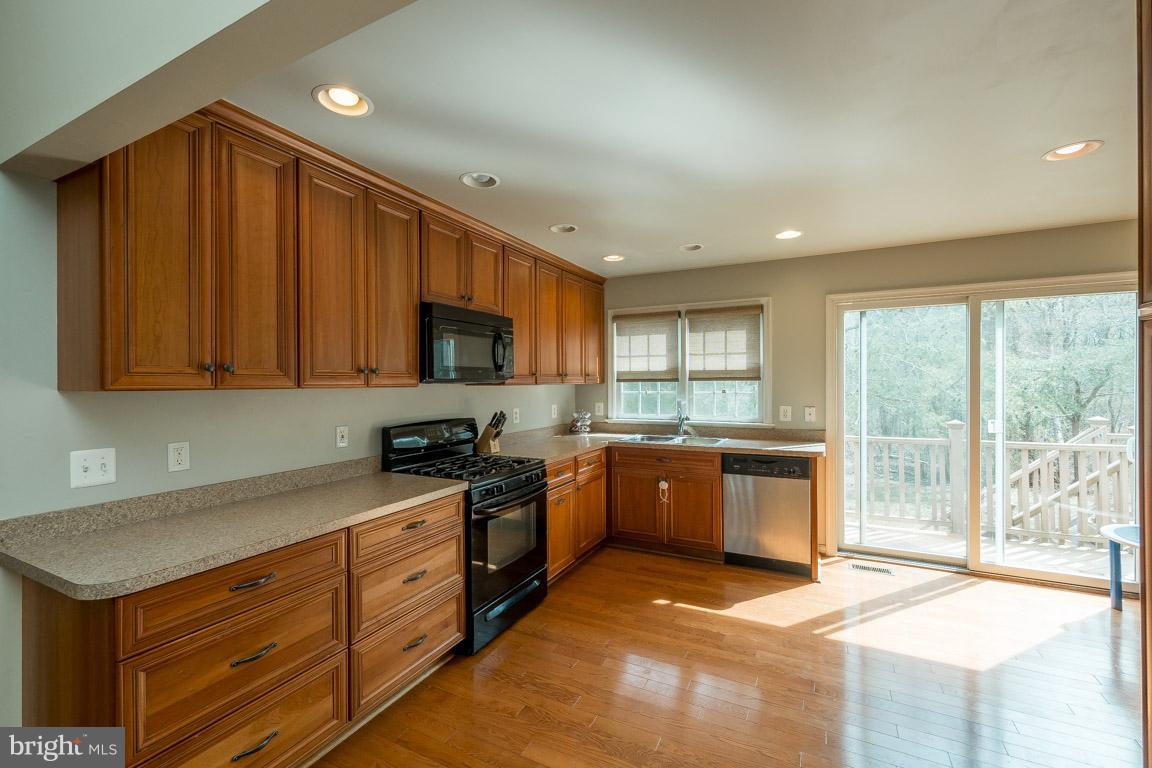 8339 Kines Road Warrenton, VA 20187 - Photo 7 of 19 a kitchen with sink a microwave and refrigerator
