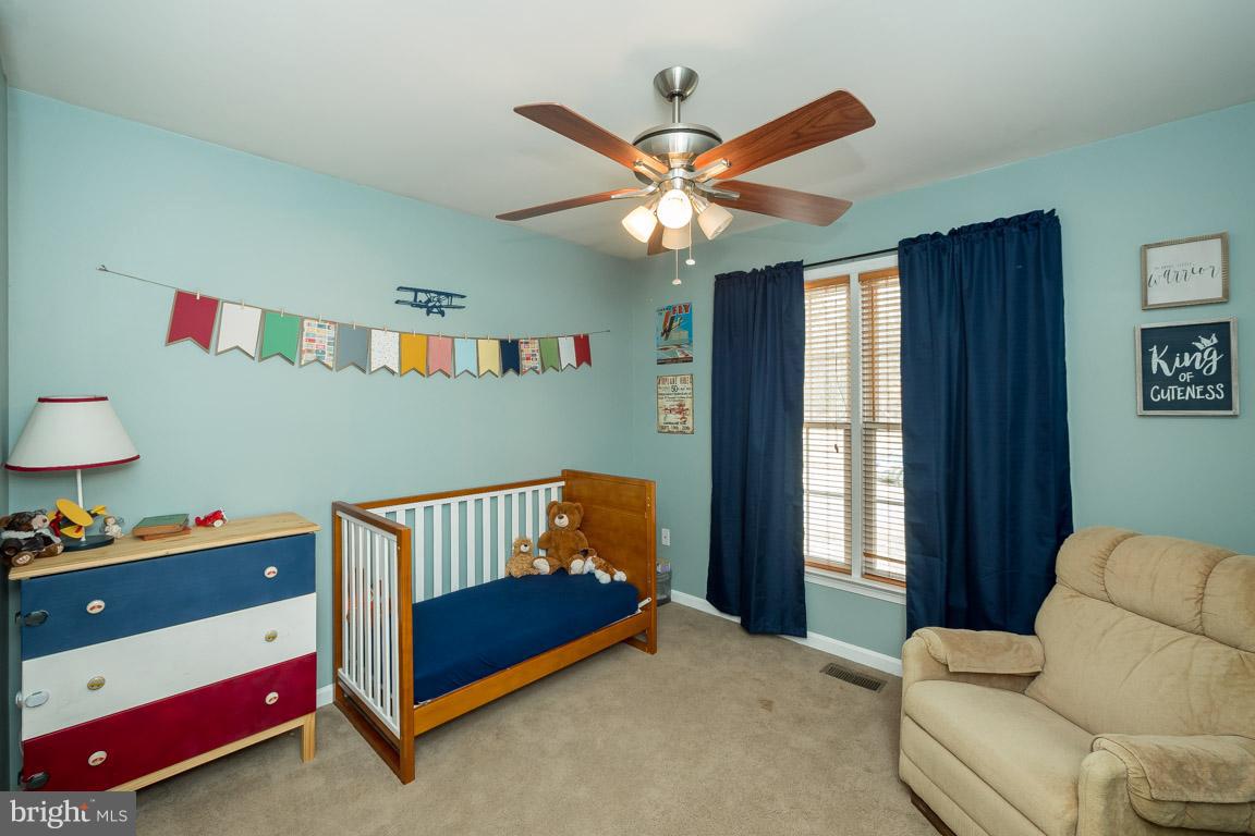 8339 Kines Road Warrenton, VA 20187 - Photo 9 of 19 a bedroom with furniture and a window