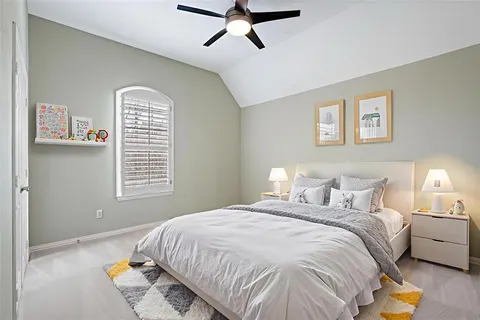 a bedroom with bed and window