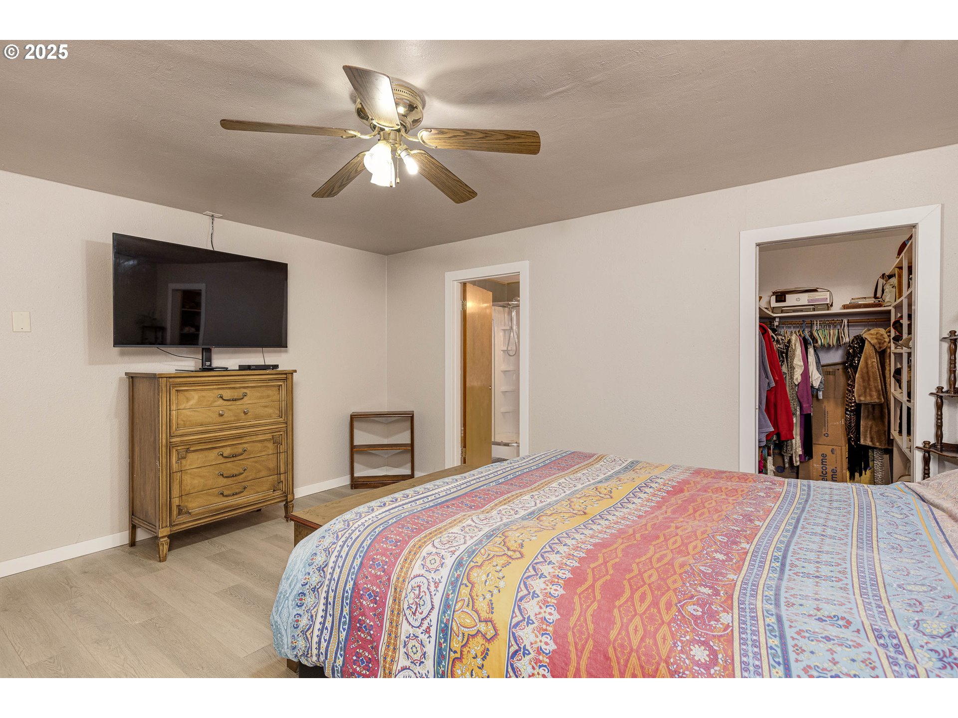 4911 15th Avenue North Keizer, OR 97303 - Photo 15 of 32 a bedroom with a bed and a flat screen tv