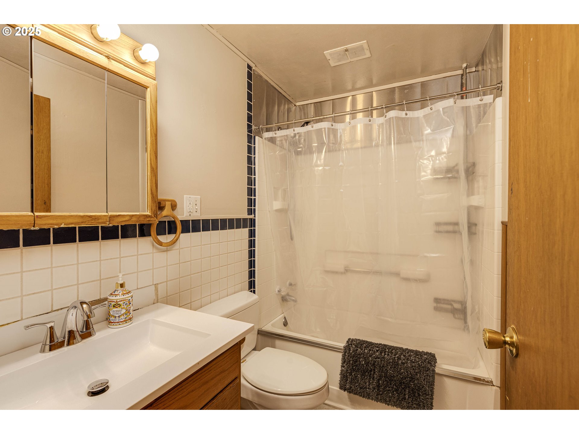 4911 15th Avenue North Keizer, OR 97303 - Photo 17 of 32 a bathroom with a sink toilet a mirror and shower