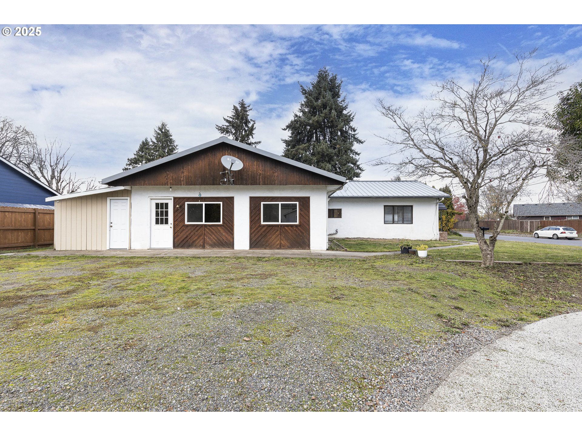 4911 15th Avenue North Keizer, OR 97303 - Photo 4 of 32 a big house with a big yard and large trees