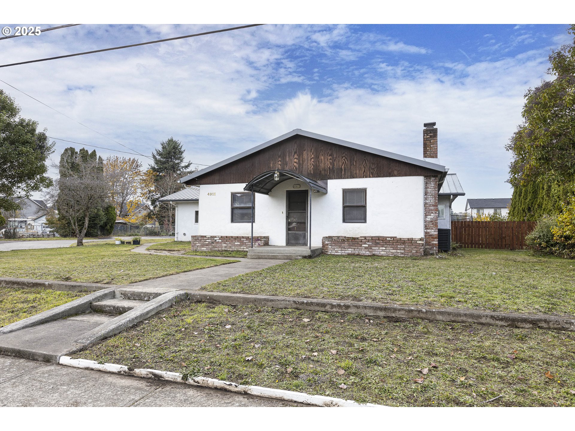 4911 15th Avenue North Keizer, OR 97303 - Photo 5 of 32 a view of a house with a yard