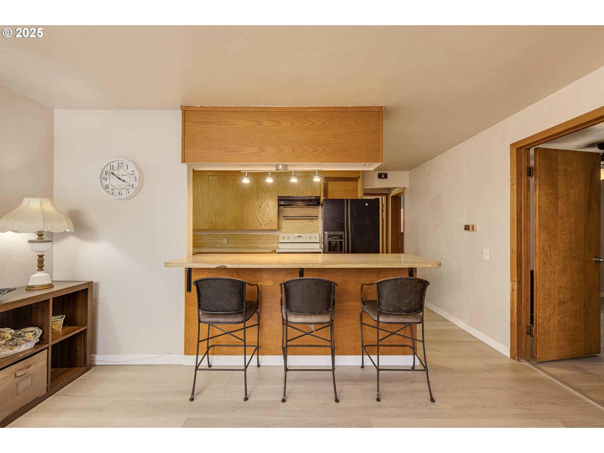4911 15th Avenue North Keizer, OR 97303 - Photo 8 of 32 a living room with a table and a wooden floor