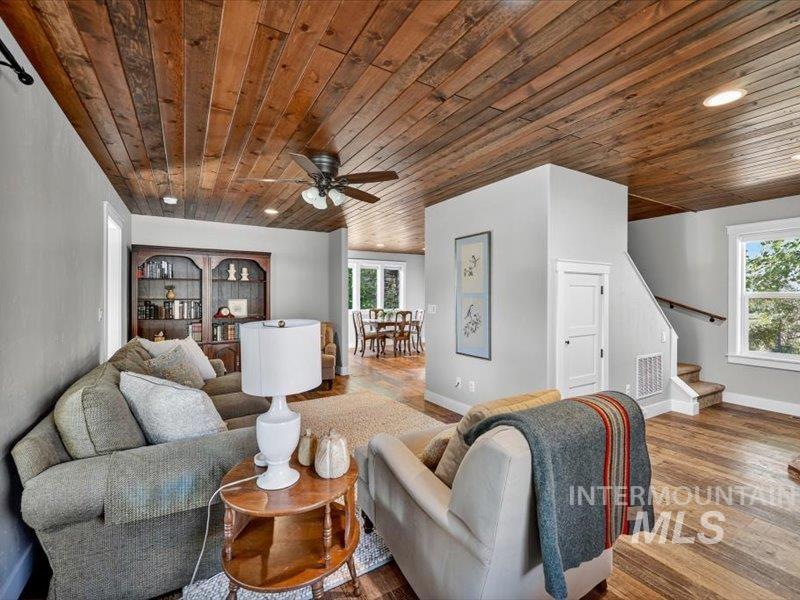 2651 Fruitvale Glendale Road Council, ID 83612 - Photo 7 of 24 Living space featuring wood-finish ceiling, recessed lighting, ceiling fan, wood-finish flooring, and a staircase with a wooden handrail