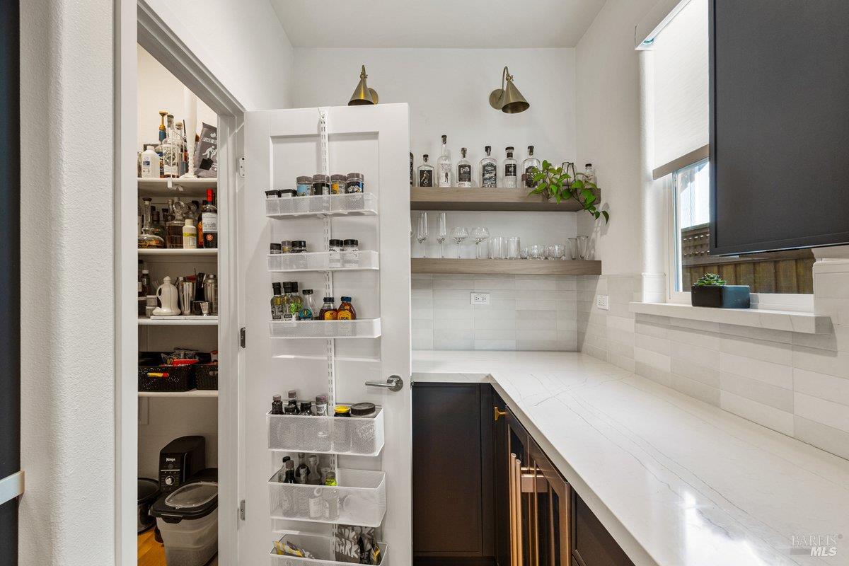 1469 Oak Circle Rohnert Park, CA 94928 - Photo 12 of 42 Thoughtfully designed walk-in pantry paired with a dedicated beverage and appliance station, offering exceptional storage, organization, and prep space.
