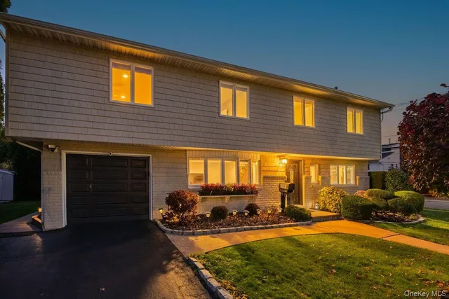 a view of a house with backyard outdoor seating area and swimming pool