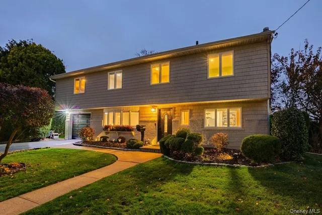 a view of a house with a swimming pool and a yard