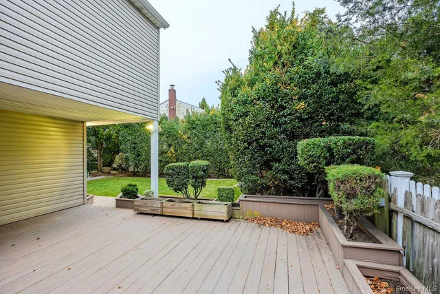 a view of house with backyard and garden
