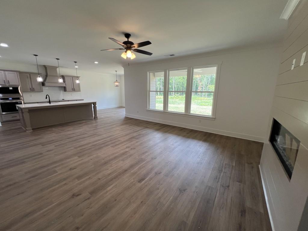 144 Tomahawk Trail Good Hope, GA 30641 - Photo 13 of 51 a living room with stainless steel appliances kitchen island hardwood floor and a window