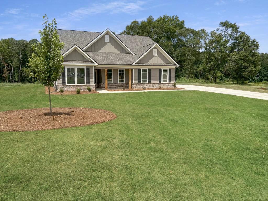 144 Tomahawk Trail Good Hope, GA 30641 - Photo 2 of 51 a front view of a house with a yard