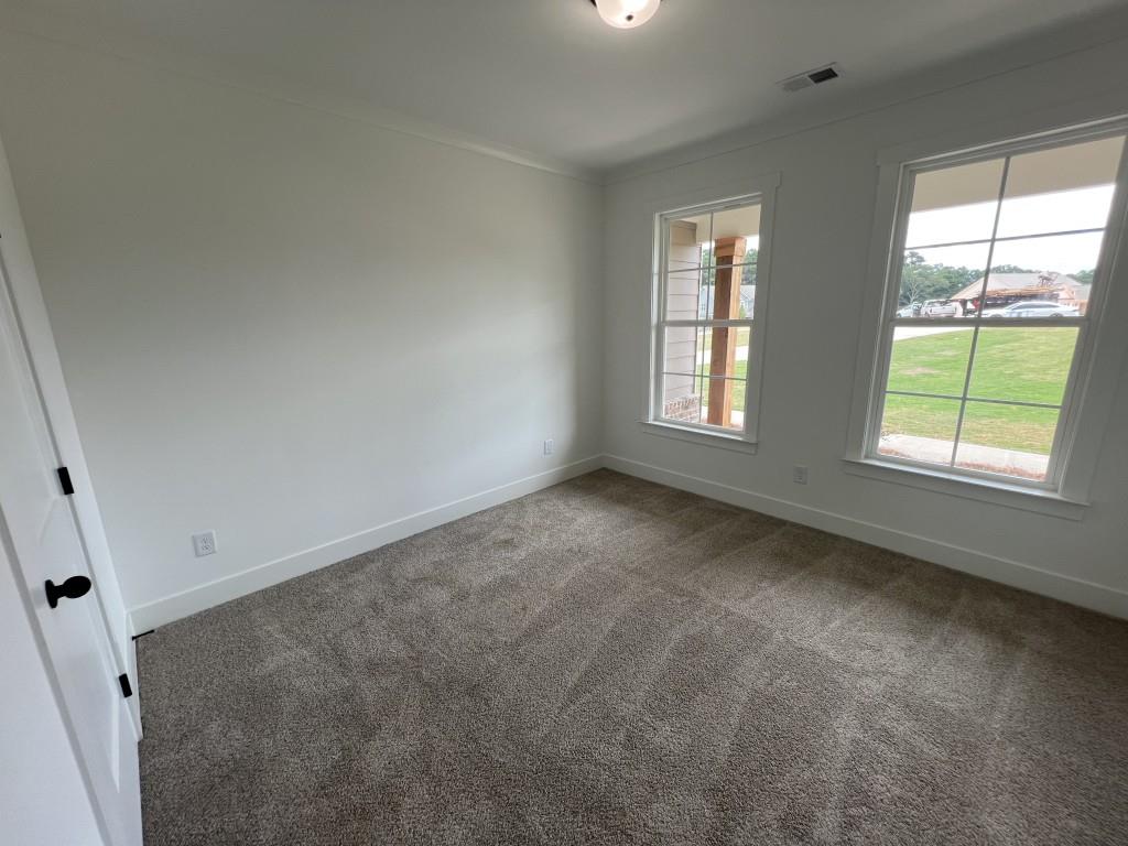 144 Tomahawk Trail Good Hope, GA 30641 - Photo 21 of 51 an empty room with windows