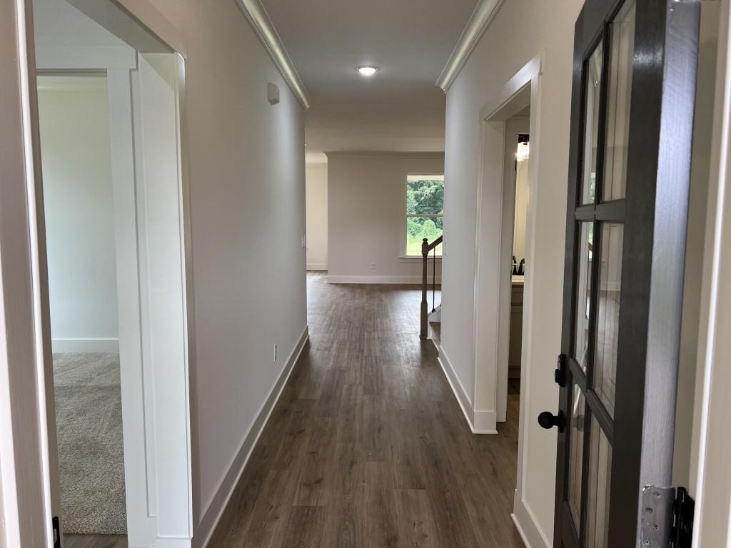 144 Tomahawk Trail Good Hope, GA 30641 - Photo 7 of 51 a view of a hallway with wooden floor