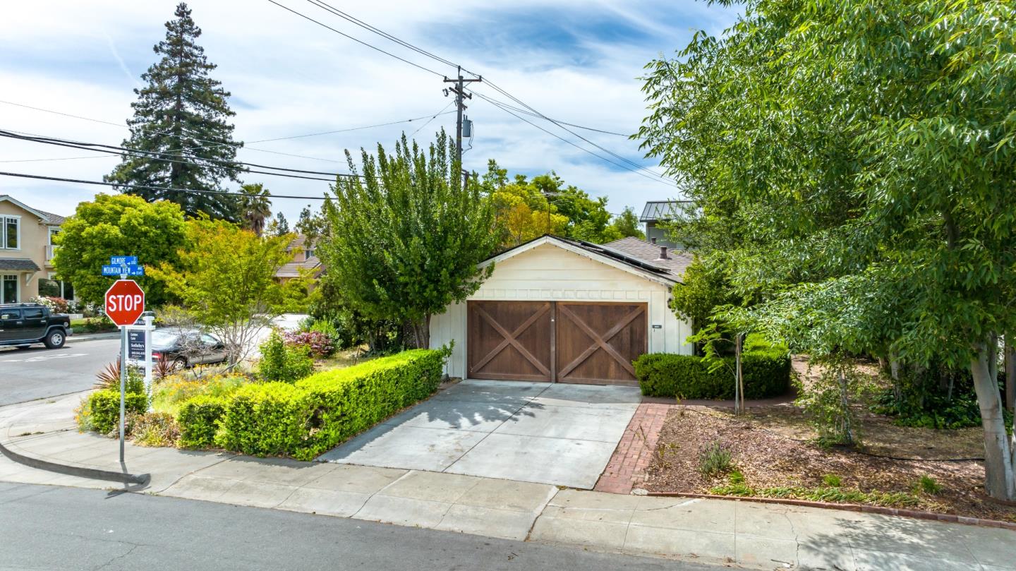 1303 Gilmore Street Mountain View, CA 94040 - Photo 1 of 12 a front view of a house with a yard and potted plants