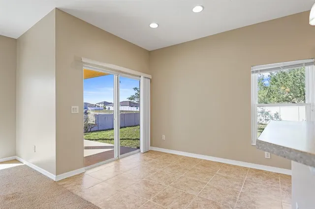 a view of room with window and entryway