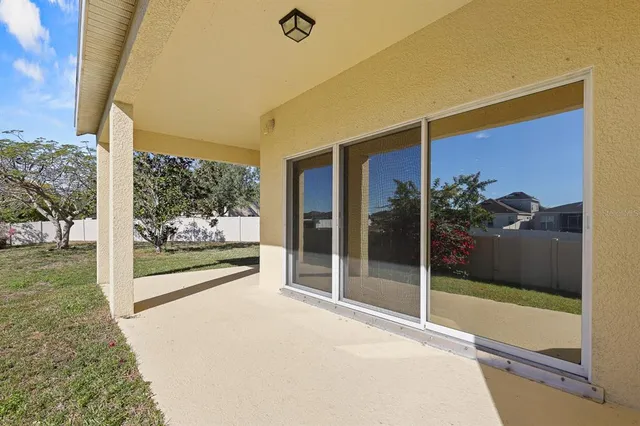 a view of a glass door and porch