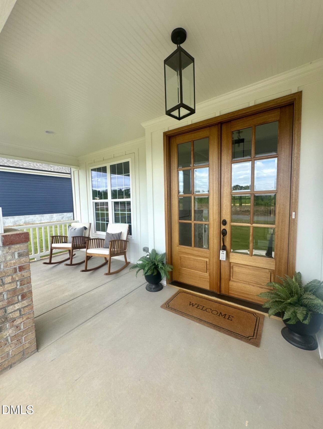 1057 Azalea Garden Circle Raleigh, NC 27603 - Photo 4 of 20 a living room with furniture and large windows