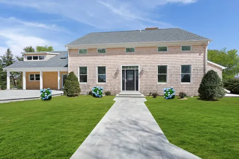 front view of a house with a yard