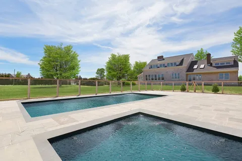 a view of swimming pool with a yard and sitting area