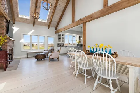 a outdoor living space with furniture and a flat screen tv