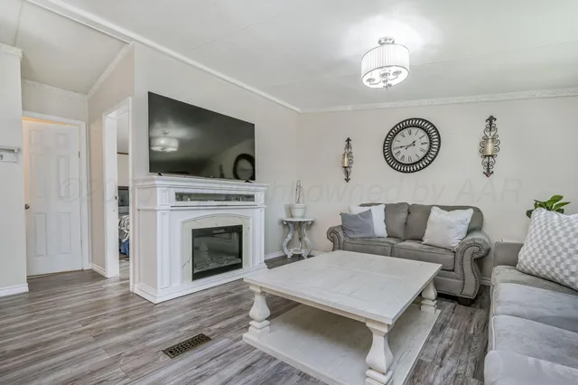a living room with a couch and a flat screen tv
