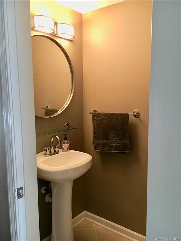 2126 Midnight Blue Lane, Unit 165 Fort Mill, SC 29708 - Photo 5 of 23 a bathroom with a sink and mirror