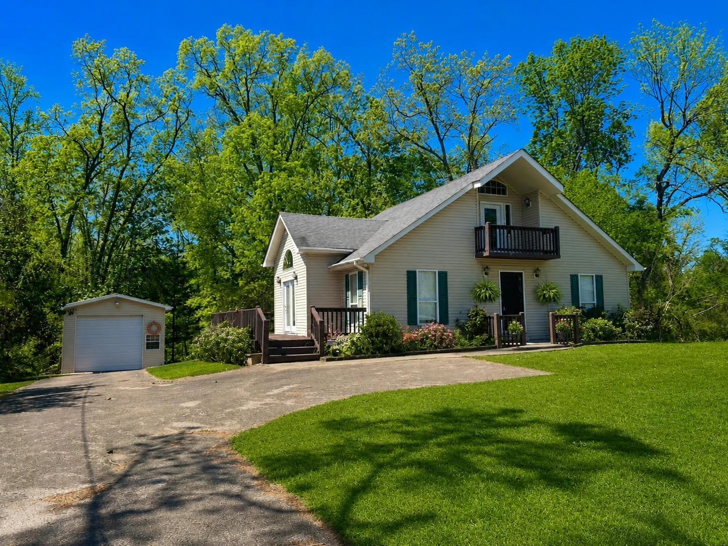 720 Riverside Lane Crump, TN 38327 - Photo 1 of 39 a front view of a house with a yard and trees
