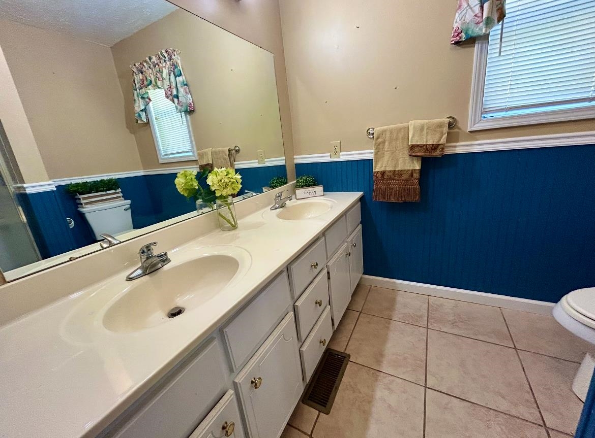 720 Riverside Lane Crump, TN 38327 - Photo 19 of 39 a bathroom with a sink and a mirror