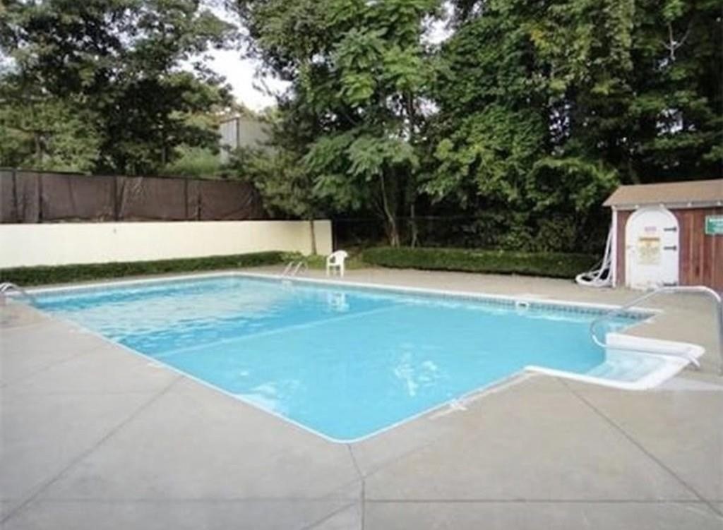 4925 Washington Street, Unit 406 Boston, MA 02132 - Photo 11 of 11 a view of swimming pool with a yard