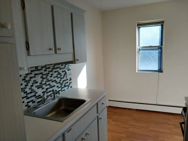 a view of a utility room with a sink