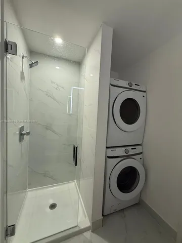 a view of a bathroom with a washer and dryer