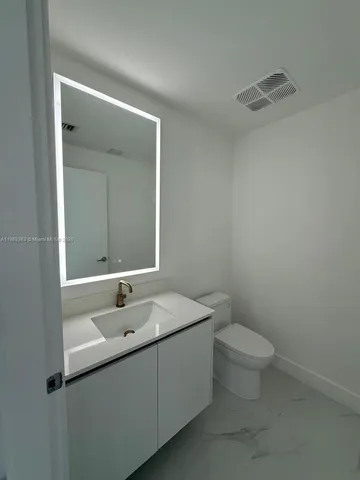 a bathroom with a sink and a toilet