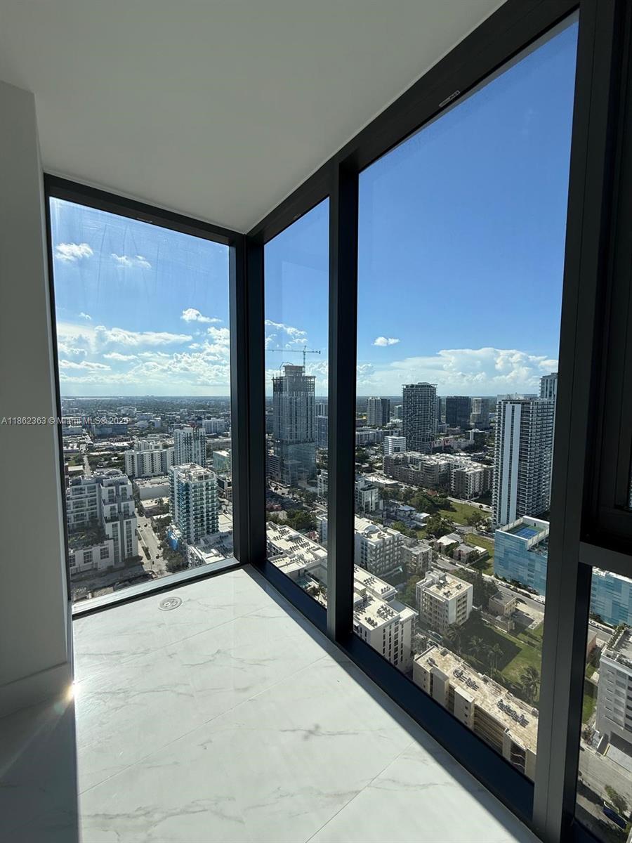 700 Northeast 24th Street, Unit 3701 Miami, FL 33137 - Photo 36 of 53 a view of a glass door and balcony