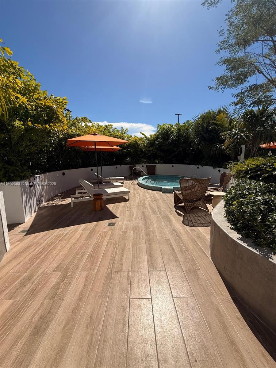 700 Northeast 24th Street, Unit 3701 Miami, FL 33137 - Photo 44 of 53 a view of swimming pool with lounge chair and fire pit