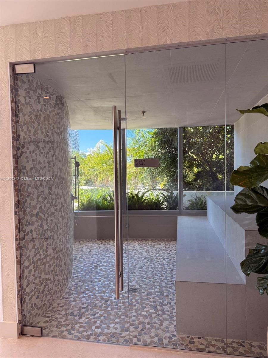 700 Northeast 24th Street, Unit 3701 Miami, FL 33137 - Photo 50 of 53 a view of a floor to ceiling window and floor to ceiling window