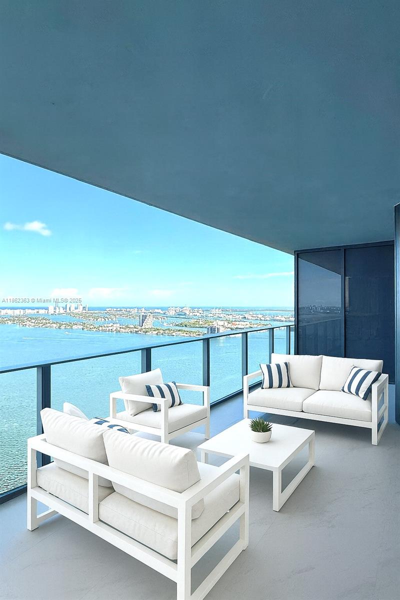 700 Northeast 24th Street, Unit 3701 Miami, FL 33137 - Photo 6 of 53 a view of a terrace with couches and lounge chairs