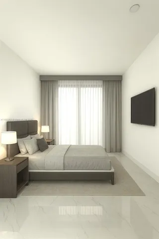 a living room with a bed furniture and a flat tv screen