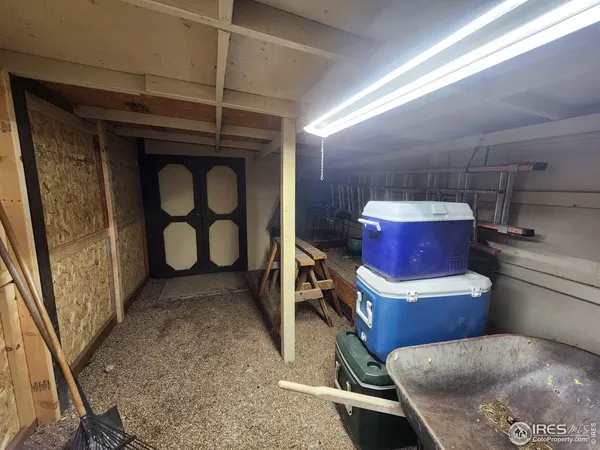 a view of a hallway with wooden shelves