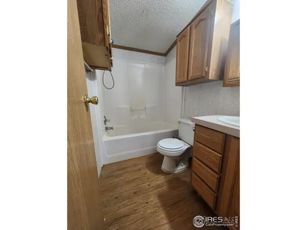 a bathroom with a toilet a sink and bathtub