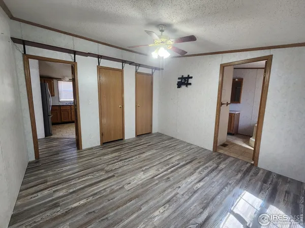 a view of a room with wooden floor and stairs
