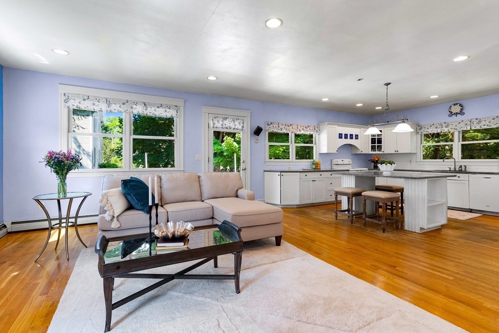 102 Gleason Road Lexington, MA 02420 - Photo 11 of 37 a living room with furniture and a table