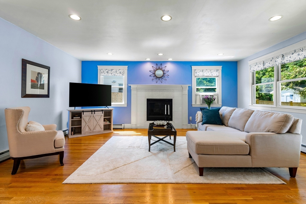 102 Gleason Road Lexington, MA 02420 - Photo 13 of 37 a living room with furniture and a flat screen tv