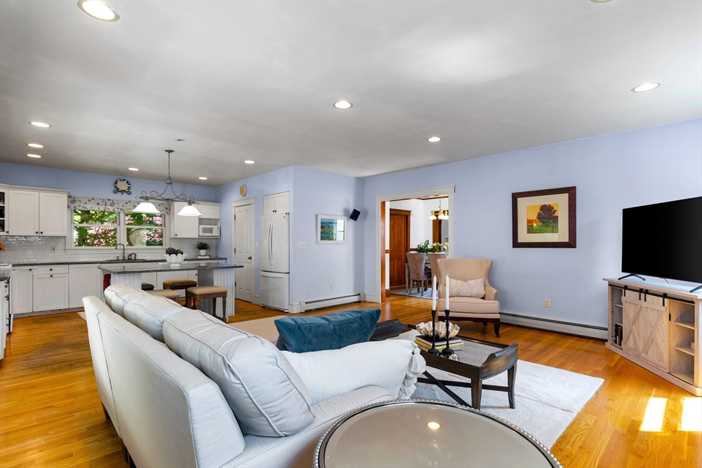 102 Gleason Road Lexington, MA 02420 - Photo 14 of 37 a living room with furniture and a flat screen tv