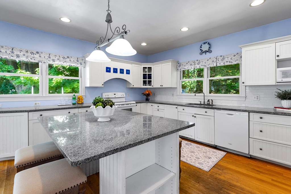 102 Gleason Road Lexington, MA 02420 - Photo 17 of 37 a kitchen with stainless steel appliances granite countertop a sink a stove and a window